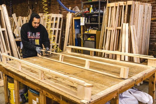 person assembling bed frame