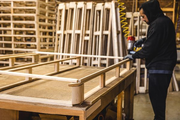 person assembling bed frame